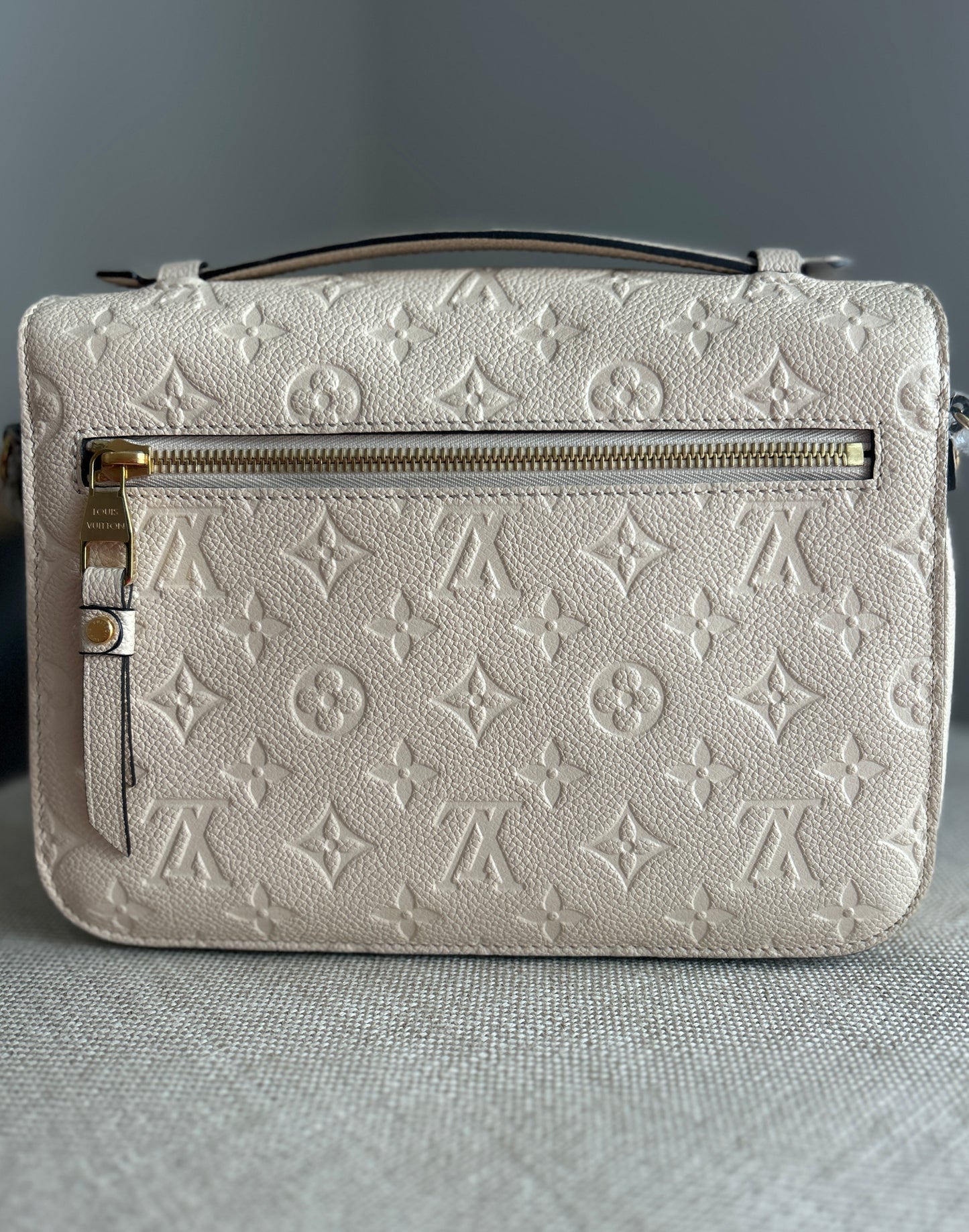 Louis Vuitton Pochette Metis Empreinte Leather in Cream