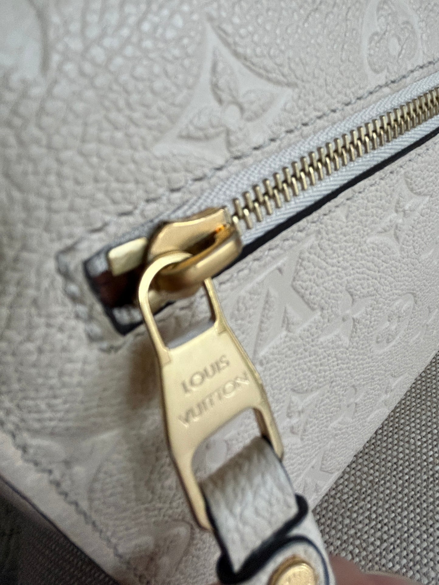 Louis Vuitton Pochette Metis Empreinte Leather in Cream