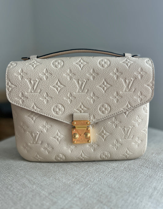 Louis Vuitton Pochette Metis Empreinte Leather in Cream