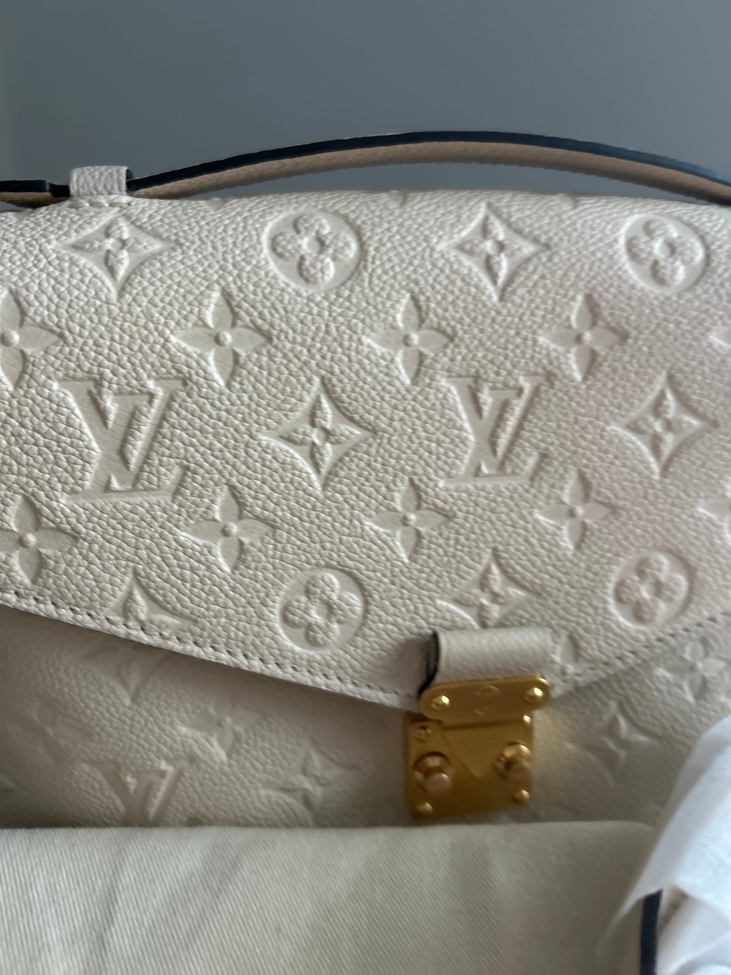 Louis Vuitton Pochette Metis Empreinte Leather in Cream