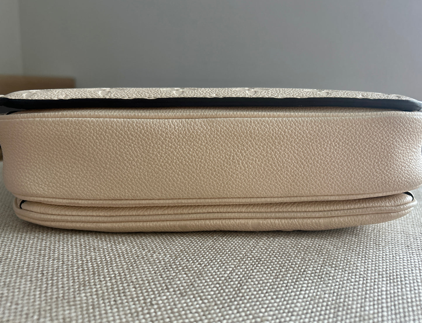 Louis Vuitton Pochette Metis Empreinte Leather in Cream